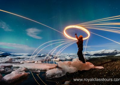 Jokulsarlon with man twirling lights